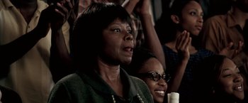 Movie still from “Glory Road” (2006), directed by James Gartner – Two women sitting in front of each other; Close Up shot, Over the shoulder angle