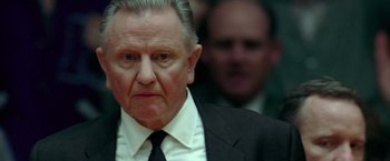 Movie still from “Glory Road” (2006), directed by James Gartner – An older man wearing a suit and tie; Close Up shot, Low angle