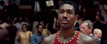 Movie still from “Glory Road” (2006), directed by James Gartner – A person wearing a red and white tank top; Close Up shot, Low angle