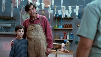 A man standing next to a woman in a room