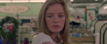 Movie still from “Go” (1999), directed by Doug Liman – A person with long hair; Close Up shot, Low angle