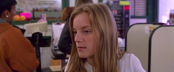 Movie still from “Go” (1999), directed by Doug Liman – A girl with long blonde hair looking to her left; Close Up shot, Low angle