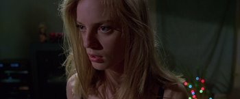 Movie still from “Go” (1999), directed by Doug Liman – A person with blonde hair; Close Up shot, Low angle