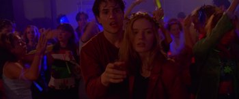 Movie still from “Go” (1999), directed by Doug Liman – A man and a woman are dancing in a room; Medium shot, Low angle