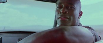 Movie still from “Go” (1999), directed by Doug Liman – A person in a car; Close Up shot, Low angle