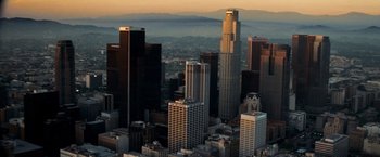 Movie still from “Goal! The Dream Begins” (2005), directed by Michael Winterbottom – A view of a city skyline at sunset; Extreme Wide shot, High angle