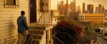 Movie still from “Goal! The Dream Begins” (2005), directed by Michael Winterbottom – A view of a city from a balcony with flowers; Extreme Wide shot, High angle