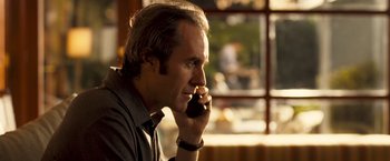 Movie still from “Goal! The Dream Begins” (2005), directed by Michael Winterbottom – A person talking on a cell phone; Close Up shot, Over the shoulder angle