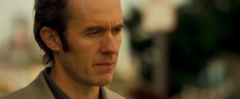 Movie still from “Goal! The Dream Begins” (2005), directed by Michael Winterbottom – A man's face looking to his left; Close Up shot, Low angle