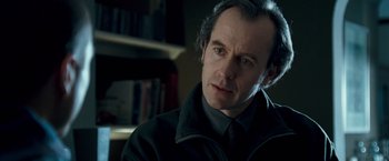 Movie still from “Goal! The Dream Begins” (2005), directed by Michael Winterbottom – A person wearing a suit and tie; Close Up shot, Low angle