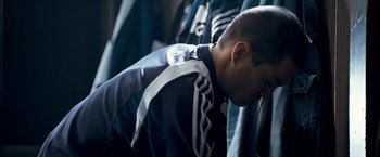 Movie still from “Goal! The Dream Begins” (2005), directed by Michael Winterbottom – A young man is leaning his head on his hands; Close Up shot, High angle