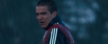 Movie still from “Goal! The Dream Begins” (2005), directed by Michael Winterbottom – A person wearing a jacket; Close Up shot, Low angle
