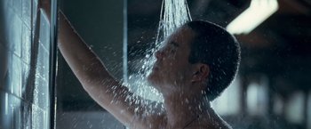 Movie still from “Goal! The Dream Begins” (2005), directed by Michael Winterbottom – A man taking a shower in a bathroom with lots of water; Close Up shot, Low angle