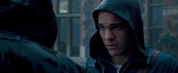 Movie still from “Goal! The Dream Begins” (2005), directed by Michael Winterbottom – A young man wearing a hooded jacket looking at the camera; Close Up shot, Over the shoulder angle