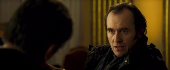 Movie still from “Goal! The Dream Begins” (2005), directed by Michael Winterbottom – A person sitting in front of a camera; Close Up shot, Over the shoulder angle