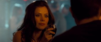 Movie still from “Goal! The Dream Begins” (2005), directed by Michael Winterbottom – A woman holding a glass of red wine in her hand; Close Up shot, Over the shoulder angle