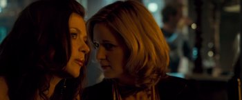 Movie still from “Goal! The Dream Begins” (2005), directed by Michael Winterbottom – Two women standing next to each other in the dark; Close Up shot, Over the shoulder angle