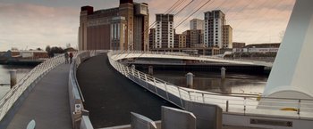 Movie still from “Goal! The Dream Begins” (2005), directed by Michael Winterbottom – A view of a bridge and a city skyline; Extreme Wide shot, High angle