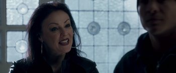 Movie still from “Goal! The Dream Begins” (2005), directed by Michael Winterbottom – A person with long black hair; Close Up shot, Over the shoulder angle