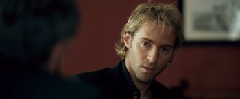 Movie still from “Goal! The Dream Begins” (2005), directed by Michael Winterbottom – A person wearing a black shirt; Close Up shot, Over the shoulder angle