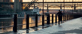 Movie still from “Goal! The Dream Begins” (2005), directed by Michael Winterbottom – A boat is in a body of water near a bridge; Extreme Wide shot, High angle