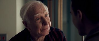 Movie still from “Goal! The Dream Begins” (2005), directed by Michael Winterbottom – An old man with a white beard looking at the camera; Close Up shot, Over the shoulder angle