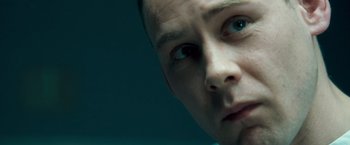 Movie still from “Goal! The Dream Begins” (2005), directed by Michael Winterbottom – A man's face in a dark room; Extreme Close Up shot, Low angle