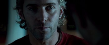 Movie still from “Goal! The Dream Begins” (2005), directed by Michael Winterbottom – A man's face in a dark room; Close Up shot, Low angle