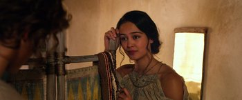 Movie still from “Gods of Egypt” (2016), directed by Alex Proyas – A young woman holding onto a piece of fabric; Close Up shot, Over the shoulder angle