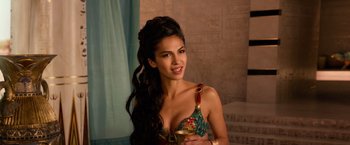 Movie still from “Gods of Egypt” (2016), directed by Alex Proyas – A beautiful young woman holding a glass of wine; Close Up shot, Over the shoulder angle