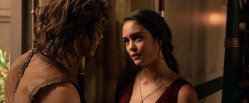 Movie still from “Gods of Egypt” (2016), directed by Alex Proyas – A woman in a red dress looking at another woman in a red dress; Close Up shot, Over the shoulder angle