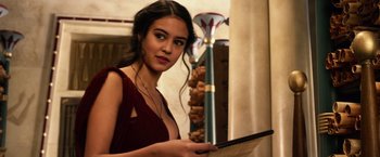 Movie still from “Gods of Egypt” (2016), directed by Alex Proyas – A beautiful young lady holding a tablet computer; Close Up shot, Over the shoulder angle