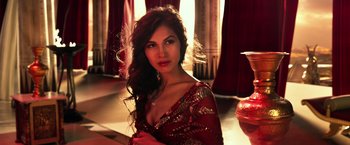 Movie still from “Gods of Egypt” (2016), directed by Alex Proyas – A beautiful woman in a red dress posing for a picture; Close Up shot, Low angle