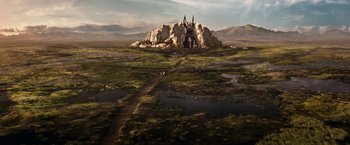 Movie still from “Gods of Egypt” (2016), directed by Alex Proyas – An aerial view of a castle on top of a mountain; Extreme Wide shot, High angle