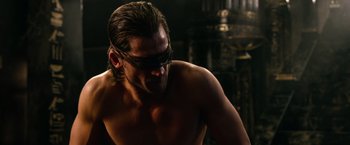 Movie still from “Gods of Egypt” (2016), directed by Alex Proyas – A man with a blindfold on his face; Close Up shot, Over the shoulder angle