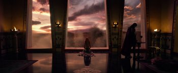 Movie still from “Gods of Egypt” (2016), directed by Alex Proyas – A woman sitting in front of an open door; Extreme Wide shot, High angle