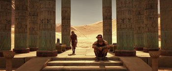 Movie still from “Gods of Egypt” (2016), directed by Alex Proyas – A man kneeling down next to a woman in front of pillars; Wide shot, High angle
