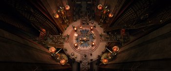 Movie still from “Gods of Egypt” (2016), directed by Alex Proyas – An overhead view of a room decorated with candles and lights; Extreme Wide shot, Overhead angle