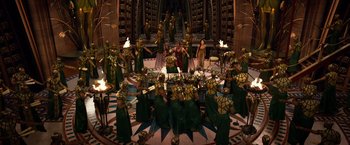 Movie still from “Gods of Egypt” (2016), directed by Alex Proyas – A group of people in green and yellow costumes; Extreme Wide shot, High angle