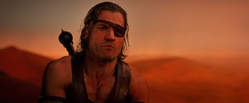 Movie still from “Gods of Egypt” (2016), directed by Alex Proyas – A person wearing a eye patch; Close Up shot, Over the shoulder angle