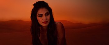 Movie still from “Gods of Egypt” (2016), directed by Alex Proyas – A beautiful woman with long dark brown hair and red lipstick; Close Up shot, Over the shoulder angle