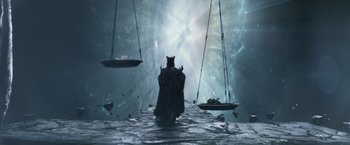 Movie still from “Gods of Egypt” (2016), directed by Alex Proyas – A cat sitting in the middle of a body of water; Extreme Wide shot, Overhead angle