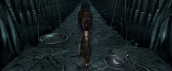 Movie still from “Gods of Egypt” (2016), directed by Alex Proyas – A group of people walking down a stone path; Wide shot, Overhead angle