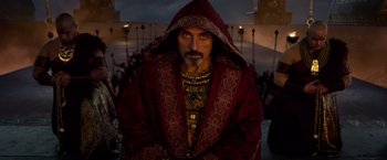 Movie still from “Gods of Egypt” (2016), directed by Alex Proyas – A man with a beard and a red robe; Medium shot, Low angle
