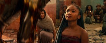 Movie still from “Gods of Egypt” (2016), directed by Alex Proyas – A young girl is looking up at a horse; Close Up shot, Over the shoulder angle
