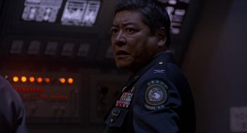 Movie still from “Godzilla vs. Destoroyah” (1995), directed by Ishirô Honda – A person wearing a military uniform; Close Up shot, Low angle