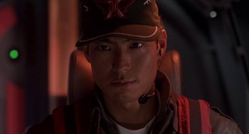 Movie still from “Godzilla vs. Destoroyah” (1995), directed by Ishirô Honda – A man wearing a baseball cap and a headset; Close Up shot, Low angle
