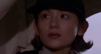 Movie still from “Godzilla vs. Destoroyah” (1995), directed by Ishirô Honda – A person wearing a hat and looking up; Close Up shot, Low angle