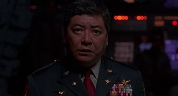 Movie still from “Godzilla vs. Destoroyah” (1995), directed by Ishirô Honda – A person wearing a military uniform; Close Up shot, Low angle