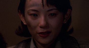 Movie still from “Godzilla vs. Destoroyah” (1995), directed by Ishirô Honda – A woman's face in the dark; Close Up shot, Over the shoulder angle